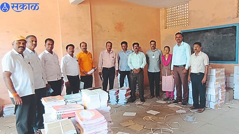 Group Education Officer Sanjay Kusalkar and others while distributing books to schools centrally from Panchayat Samiti office.