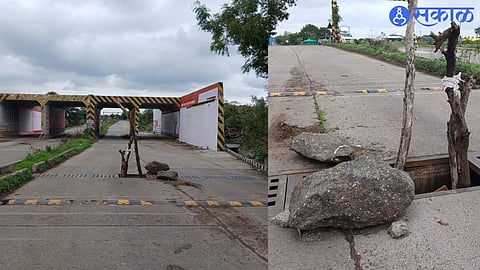 Wood piles in open drains on road