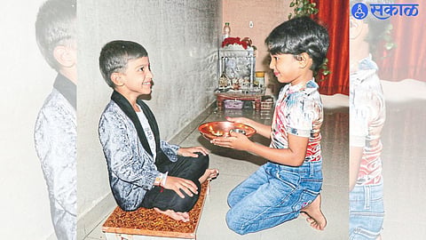 Sister celebrating her brother on the occasion of Raksha Bandhan.