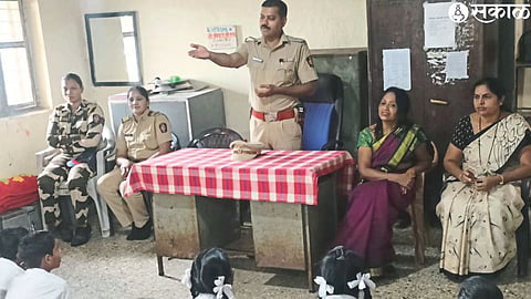 A. T. Senior Police Inspector of Mhasrul Police Station Atul Dahake while interacting with the students of Pawar Secondary School, Primary and Secondary Ashram Schools.