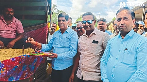 Traders Association President Nandkumar Daga, Traders Sagar Thorat, Secretary Narendra Pradhana while worshiping Soybean Tractor in Market Committee at Lasalgaon.