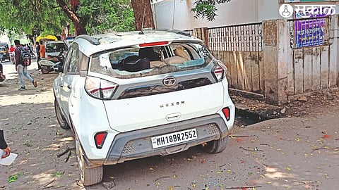 A car damaged by a mob.