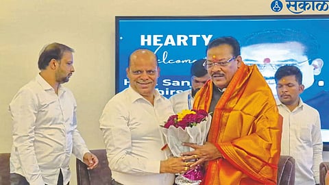Teacher MLA Kishore Darade felicitating Social Justice Minister Sanjay Shirsat.