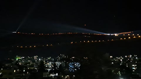 Ajinkyatara Fort illuminated by thousands of torches during the grand royal procession in Satara, celebrating Maratha pride and cultural heritage."