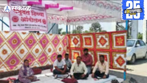 "Residents of Tembhu gather for an indefinite sit-in protest at the historic Tembhu walls, advocating for justice and social change."