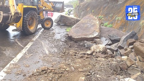 Debris from a landslide blocks the Pune-Khed Shivapur highway near New Katraj Tunnel amid heavy rainfall, disrupting traffic as monsoon intensifies