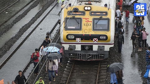 Commuters stranded at Mumbai railway station as heavy rains disrupt local train services for the third consecutive day.