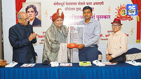 Vikrant Ajagawkar proudly receiving the Keshavrao Bhosale Kaladarsh Award for his remarkable contributions to Marathi arts.