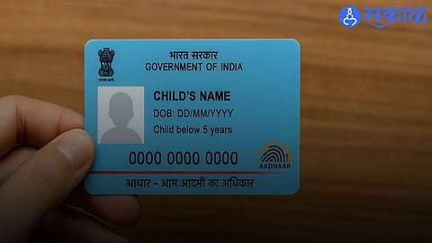 Parents enrolling their child for Aadhaar Card at an Aadhaar Seva Kendra using birth certificate and parent Aadhaar details.