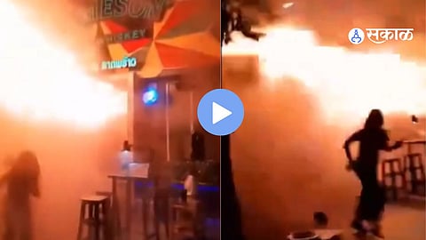 Massive flames engulf a Bangkok pub as firefighters battle the blaze following a deadly nightclub fire that killed 27 people and injured dozens.