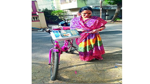 female newspaper distributor.jpg