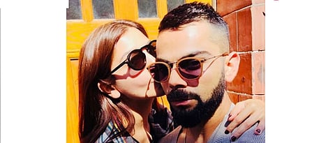 Anushka Sharma kisses Virat Kohlis hand as he misses father at Delhi event