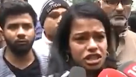 frustrated student from Jamial Milia express in front of media