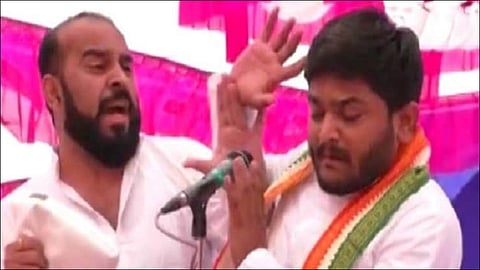 Congress leader Hardik Patel slapped during a public meeting in Gujarat
