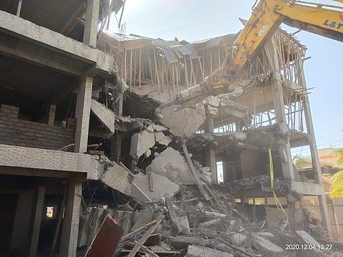 A four-storey building constructed illegally in Santnagar area of Lohgaon on Saturday has been demolished by the Municipal Corporation..jpg