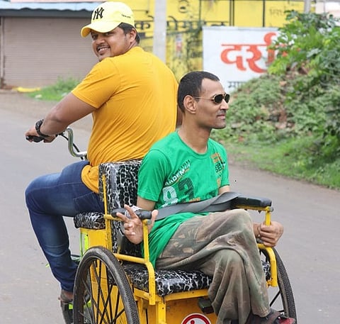 Seeing his friend's trouble, he made a Corona wheelchair