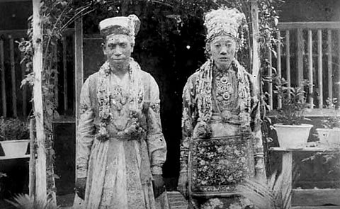 Old picture of a newly married Chitty couple. The groom A Subramaniam Pathair is wearing a traditional South Indian wedding dress and the bride L Chinamah Naiken is wearing the Baba-Nyonya headdress and the Malay Baju Kebaya Panjang Labuh.
Images: K Nadarajan Raja