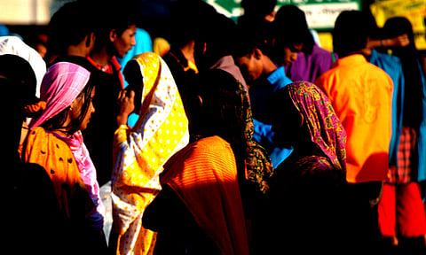 Workers at a garment factory in Bangladesh before starting another day of work.
Credit: Flickr / Ashiful Haque