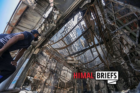 Irfan, a Sri Lankan Muslim businessman inspects his vandalised shop, Mohideen City Shoe Palace, following sectarian clashes in Minuwangoda, Sri Lanka. May 2019. Photo: ZUMA Press / IMAGO