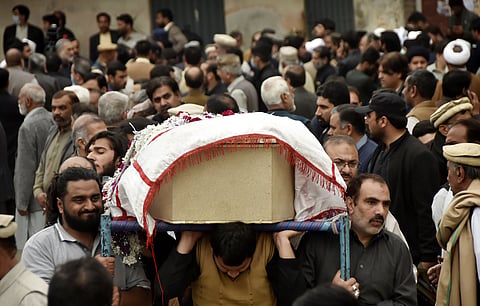 A funeral for victims of a blast in Peshawar in March 2022. The attack occurred at a Shia congregation hall, but many publications in Pakistan did not identify the victims as Shias. Photo: IMAGO / Xinhua