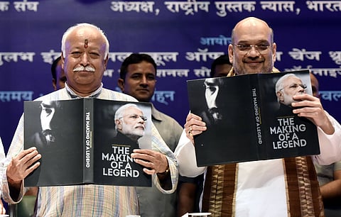 The RSS chief Mohan Bhagwat (left) and Narendra Modi’s close confidante Amit Shah (right) releasing a book on Modi’s life in 2017. The RSS leadership has been uncomfortable with Modi outgrowing its control since he became India’s prime minister in 2014.