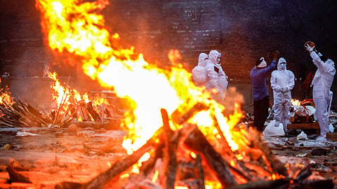 Relatives of Covid-19 victims performing last rites at a crematorium in New Delhi in May 2021. Data from India shows 3.7 million excess deaths during the pandemic years of 2020 and 2021, revealing an undercounting of Covid-19 deaths by an estimated seven times.