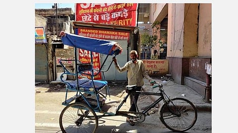 ரிக்ஷா ஓட்டுநர் உத்தம் குமார் சிங்.