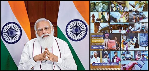 குஜராத் மாநிலத்தைச் சேர்ந்த கரிப் கல்யாண் அன்ன யோஜனா திட்ட பயனாளிகளுடன் பிரதமர் மோடி நேற்று டெல்லியில் இருந்து காணொலிக் காட்சி மூலம் உரையாடினார். படம்: பிடிஐ