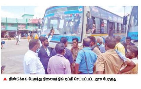 திண்டுக்கல்லில் அரசு பேருந்து ஜப்தி: பயணிகள் இறங்க மறுத்து வாக்குவாதம்