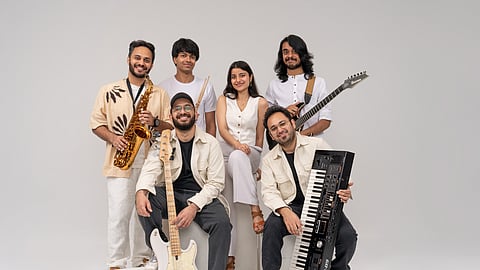 In frame: Members of The Revisit Project