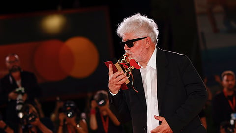 Pedro Almodovar, winner of the golden lion for best film for 'The Room Next Door', poses for photographers
