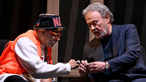 Spike Lee (L) and Billy Crystal (R) compare rings
