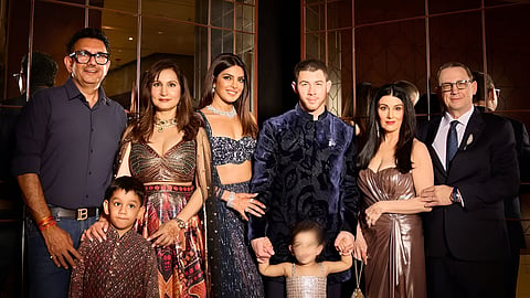 Priyanka Chopra and Nick Jonas (C) with family at the wedding celebrations