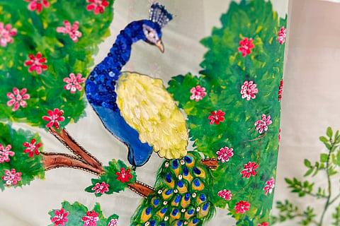 Glimpse of a hand-painted saree in Label Devina