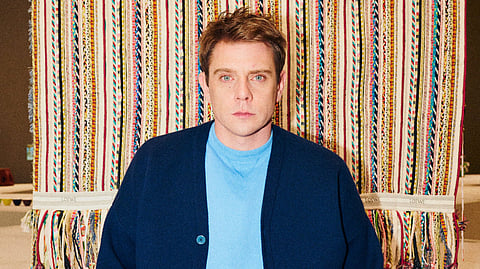Why is Jonathan Anderson hailed as the busiest fashion designer in the world?