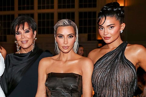 Kris Jenner, Kim Kardashian, Kylie Jenner in a row