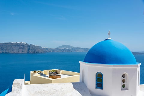 Why do Greek islands have white and blue houses?