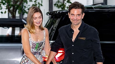 Gigi Hadid highlights her relationship with Bradley Cooper by wearing a $2,995 custom gold and diamond pendant