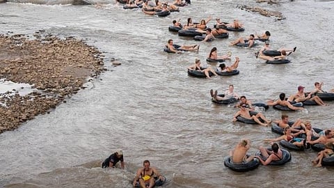 Tipsy Tubing in Thailand is Pai’s backpacker-famous river party float combining tubing, DJs, bar stops, and non-stop social energy