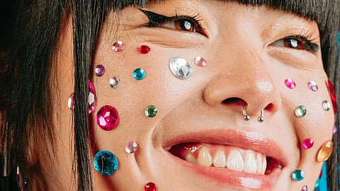 Faux gemstones are also being used as face decorations