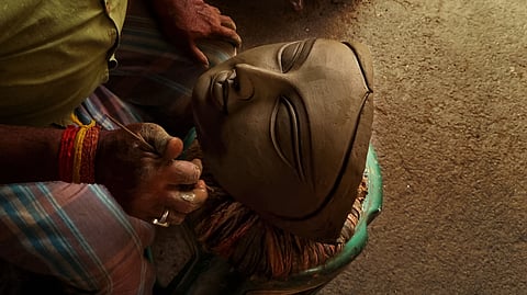 A centuries-old Bengal custom brings earth from a sex worker’s doorstep into the sacred craft of the Puja image