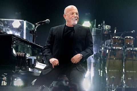 Tired of the hustle? Billy Joel has a song for that