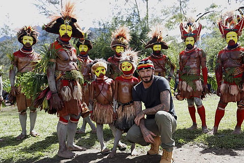 Beckham with indigenous tribesmen in Western Highlands Province, Papua New Guinea