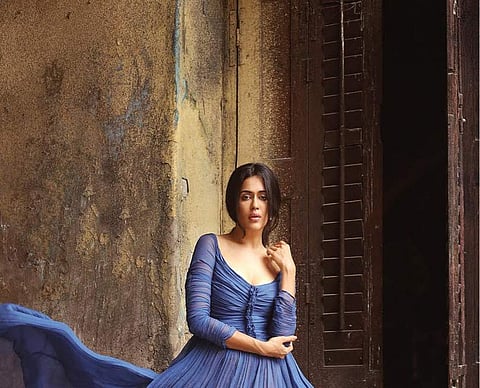A collection of cerulean blue to steel blue gowns