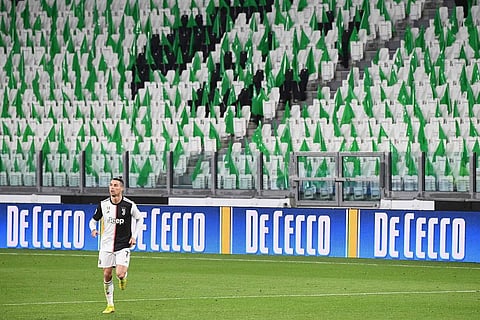 Cristiano Ronaldo an empty Juventus stadium (AFP/Vincenzo PINTO)