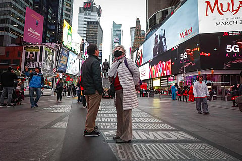 At Times Square, New York (AP Photo/John Minchillo)