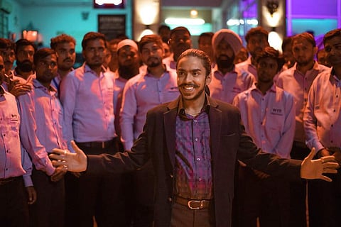 A still from The White Tiger featuring Adarsh Gourav