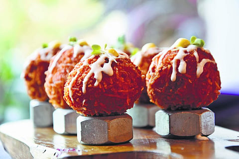 Semiya Upma Arancini balls served atop metal nut bolts!