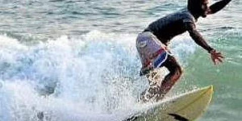 A surfer at Kovalam