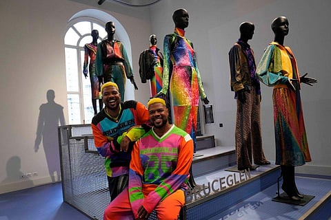 In frame: Designers Glen and Bruce Proctor pose for portraits in front of their creations at the fashion hub